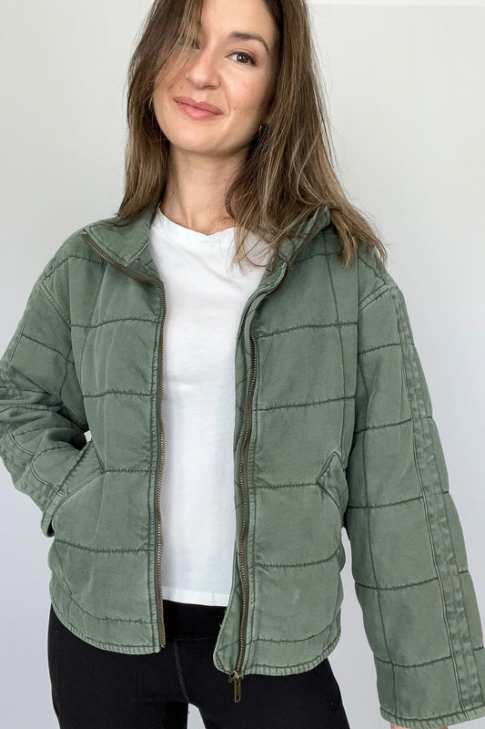 The Tiny Details modeling a Green Dolman Quilted Denim Jacket for women